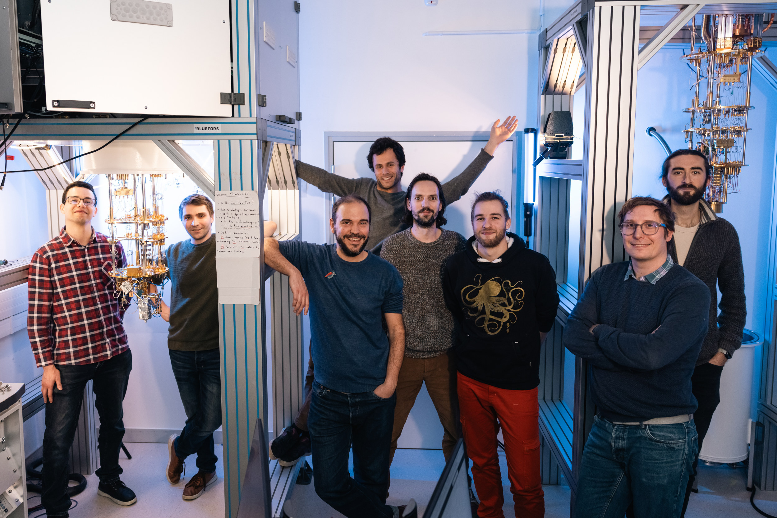 Group photo of team members standing next to each other in the lab.